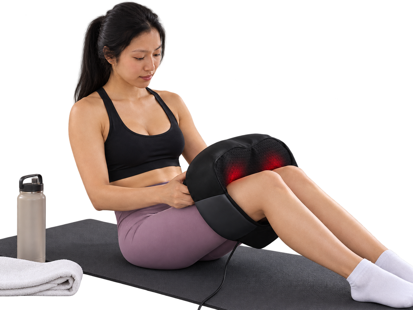 Woman using the Aerlang Shiatsu Massager on her calf